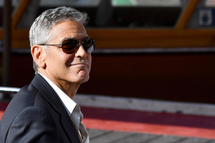 Actor George Clooney smiles as he leaves on a boat during the 74th edition of the Venice Film Festival, in Venice, Italy, Friday, Sept. 1, 2017. (Ettore Ferrari/ANSA via AP)