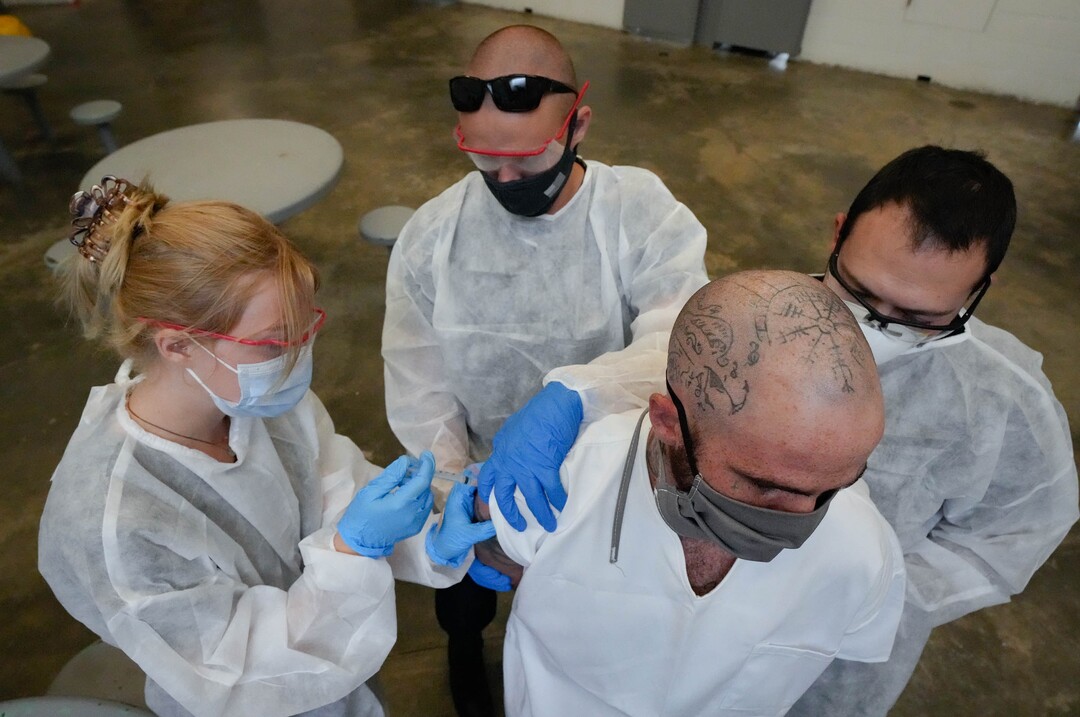 (Francisco Kjolseth | The Salt Lake Tribune) Orion Anderson receives the COVID-19 vaccine from Nomi Health staff at the Utah State Prison in Draper, on Tuesday, July 27, 2021.