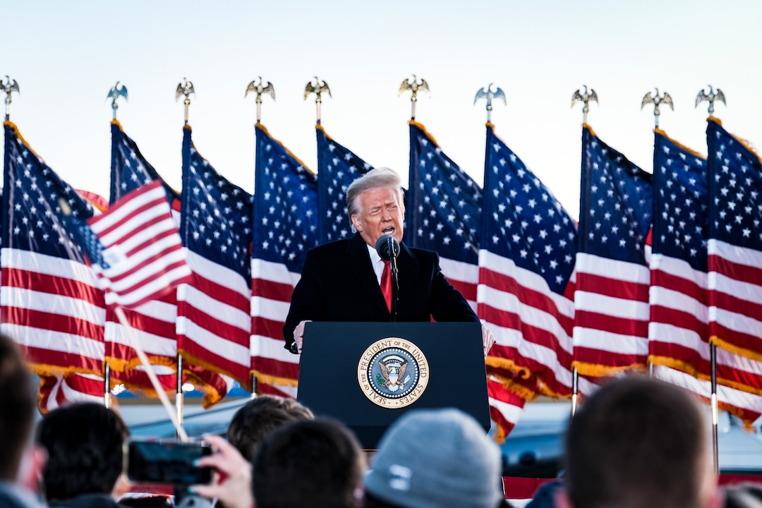 President Donald Trump speaks to supporters before boarding Air Force One for the last time at Joint Base Andrews in Maryland, Jan. 20, 2021, hours before the presidential inauguration of Joe Biden. Defeated and twice impeached, the 45th president used his farewell remarks before a sparse crowd to brag about his record and wish luck to the incoming administration. (Pete Marovich/The New York Times)