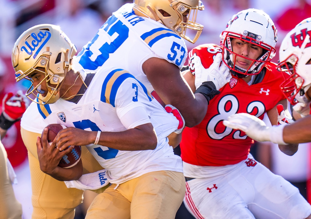 (Rick Egan | The Salt Lake Tribune)  Utah Utes defensive end Jonah Elliss (83) grabs UCLA Bruins quarterback Dante Moore (3) as he brings him down for a quarterback sack, in the final Bruin drive in the 4th quarter, in PAC-12 football action between the Utah Utes and theUCLA Bruins, at Rice-Eccles Stadium, on Saturday, Sept. 23, 2023.