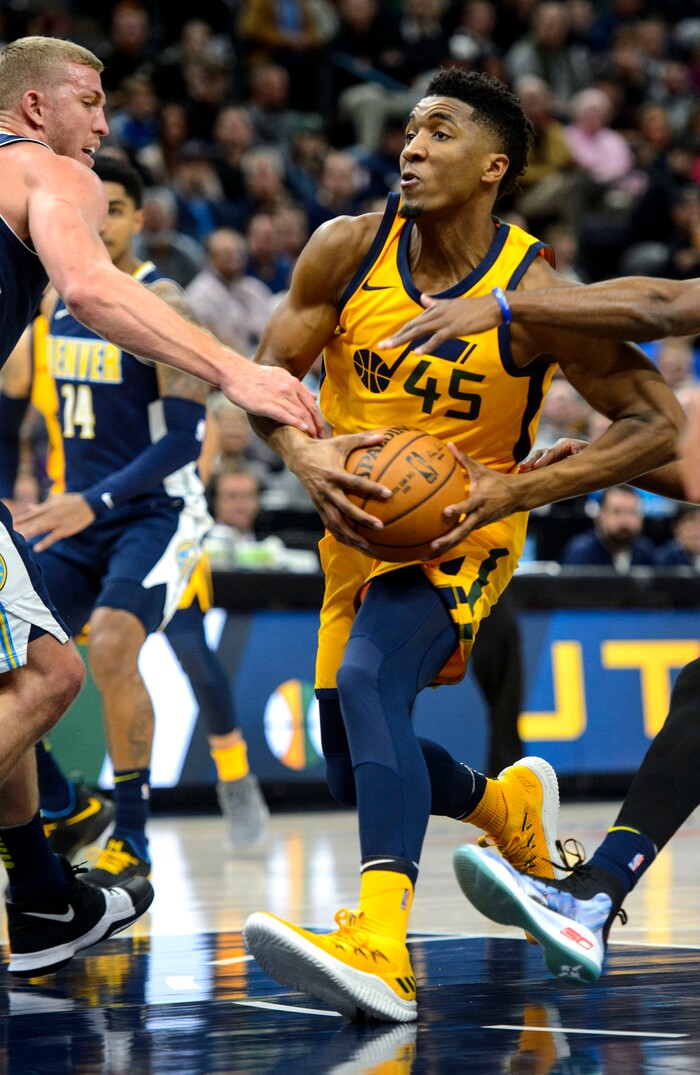 (Steve Griffin  |  The Salt Lake Tribune) Utah Jazz guard Donovan Mitchell (45) drives past the Denver defense during the Utah Jazz versus Denver Nuggets NBA basketball game at Vivint Smart Home Arena  in Salt Lake City Tuesday November 28, 2017.