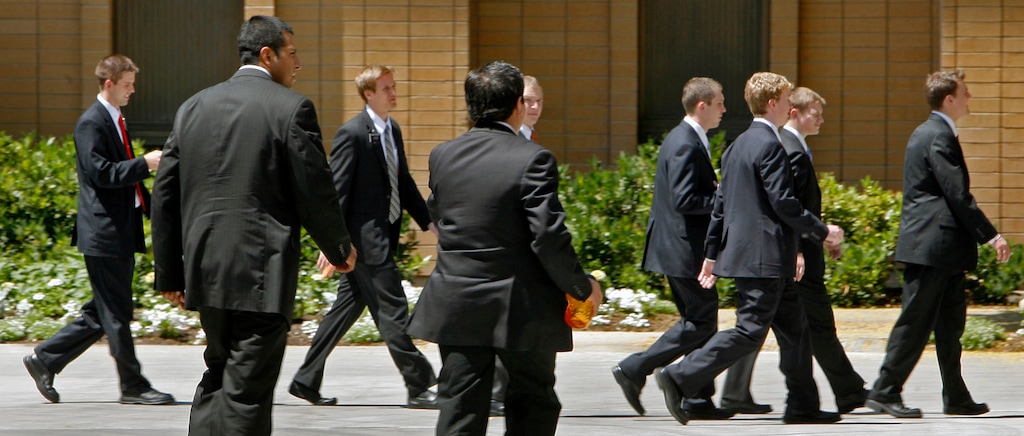 (Steve Griffin/The Salt Lake Tribune)
 New missionaries walk on the campus of the Missionary Training Center in Provo June 25, 2007.