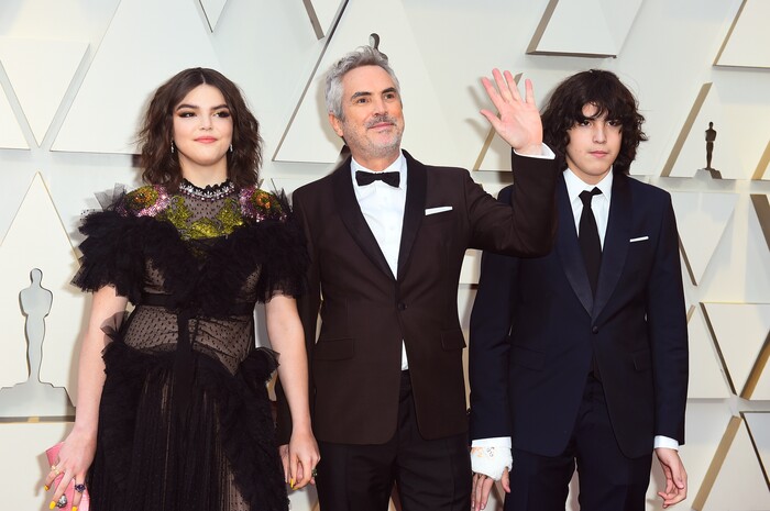 Tess Bu Cuaron, from left, Alfonso Cuaron, and Olmo Teodoro Cuaron arrive at the Oscars on Sunday, Feb. 24, 2019, at the Dolby Theatre in Los Angeles. (Photo by Jordan Strauss/Invision/AP)