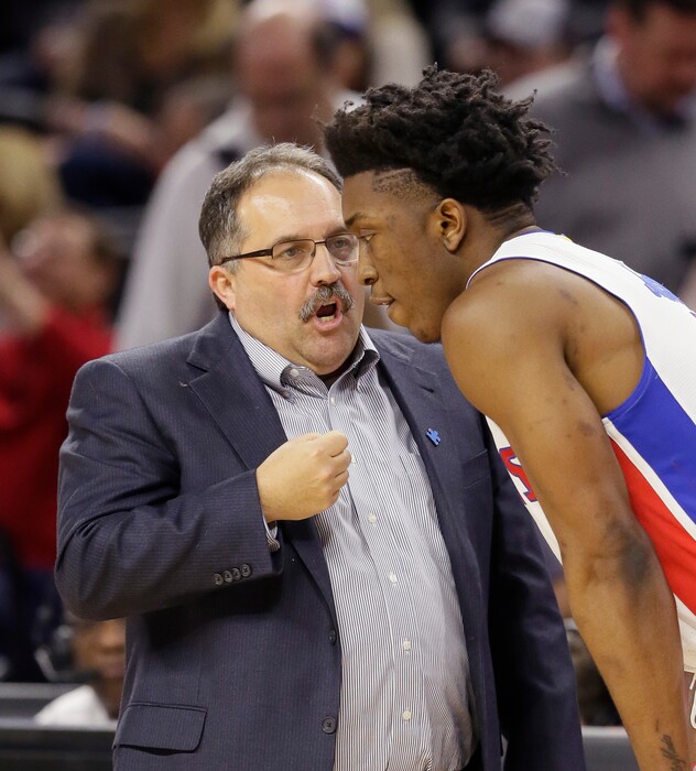 Detroit Pistons head coach Stan Van Gundy talks with Detroit Pistons forward Stanley Johnson during the first half of an NBA basketball game against the Dallas Mavericks, Friday, April 1, 2016, in Auburn Hills, Mich. (AP Photo/Carlos Osorio)