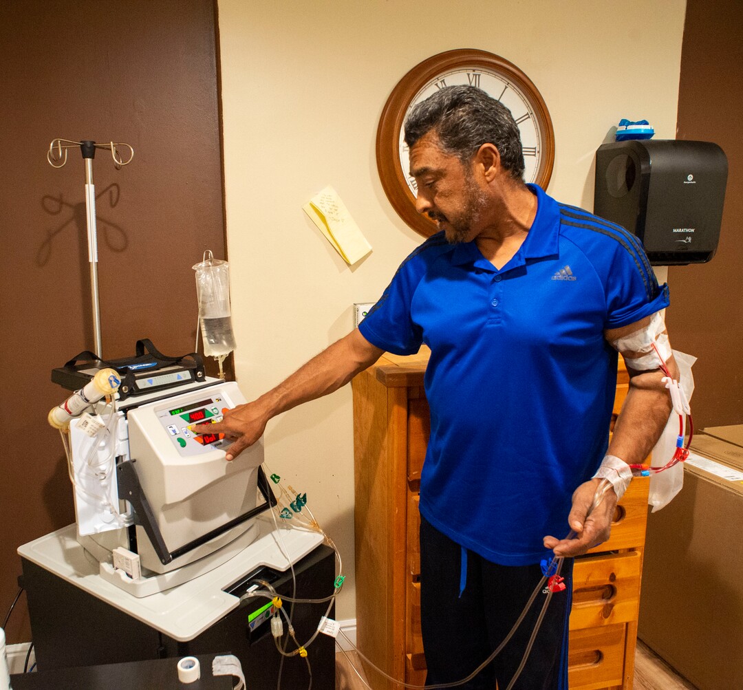 (Rick Egan  |  The Salt Lake Tribune)     Raul Gutierrez goes through the steps to setup his machine, as an in-home dialysis patient. Thursday, Sept. 5, 2019.