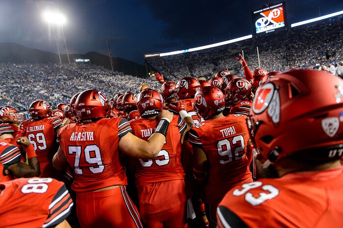 (Trent Nelson | The Salt Lake Tribune)  Utah players huddle before the game as BYU hosts Utah, NCAA football in Provo, Saturday September 9, 2017.
