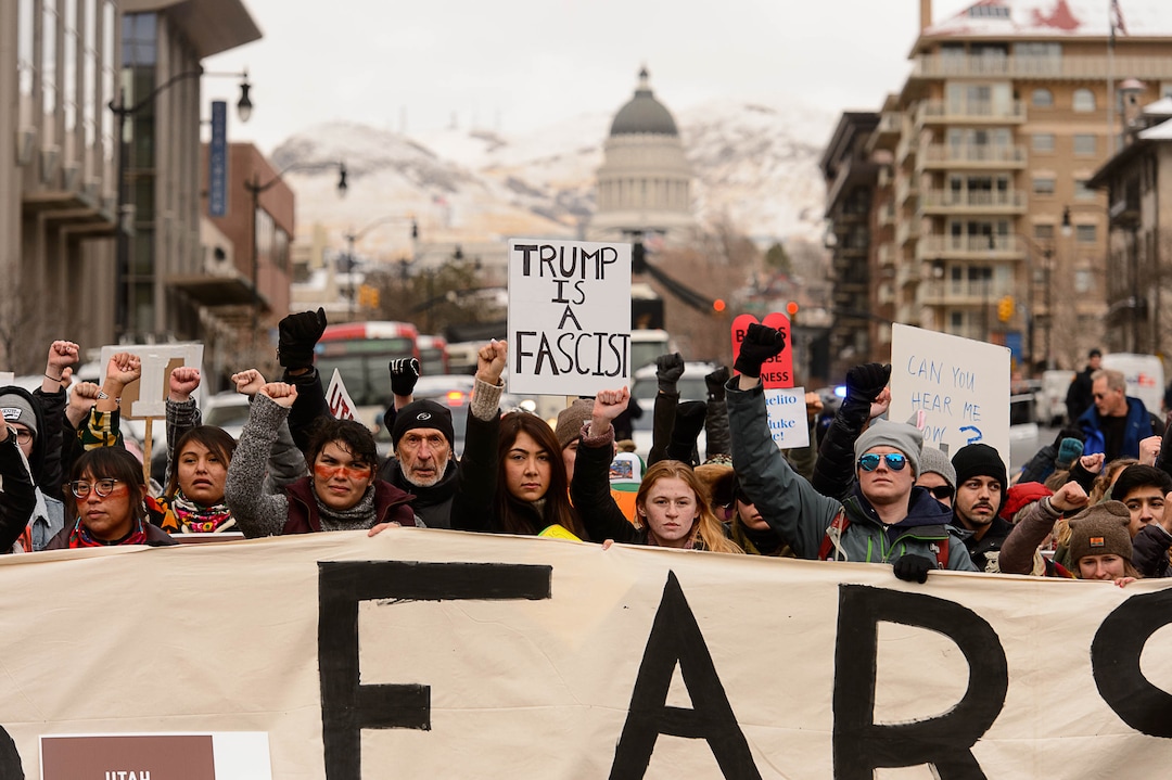 (Trent Nelson | The Salt Lake Tribune)  Protesters block off an intersection downtown after a rally against a visit by President Donald Trump, Monday December 4, 2017.