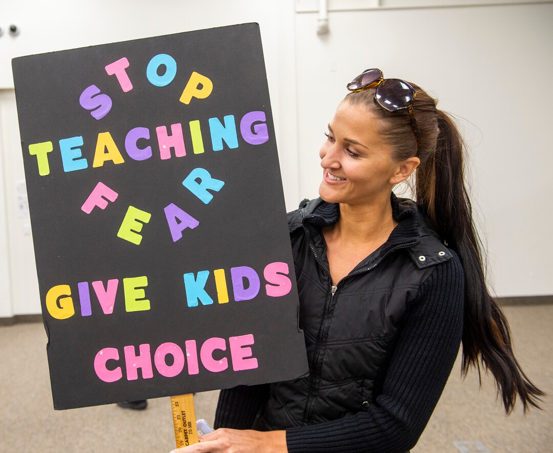 (Rick Egan  |  The Salt Lake Tribune)   Emily Haverfield made a sign for the Jordan School Board meeting about the17 Covid-19 cases at Riverton High School, on Wednesday, Sept. 16, 2020.
