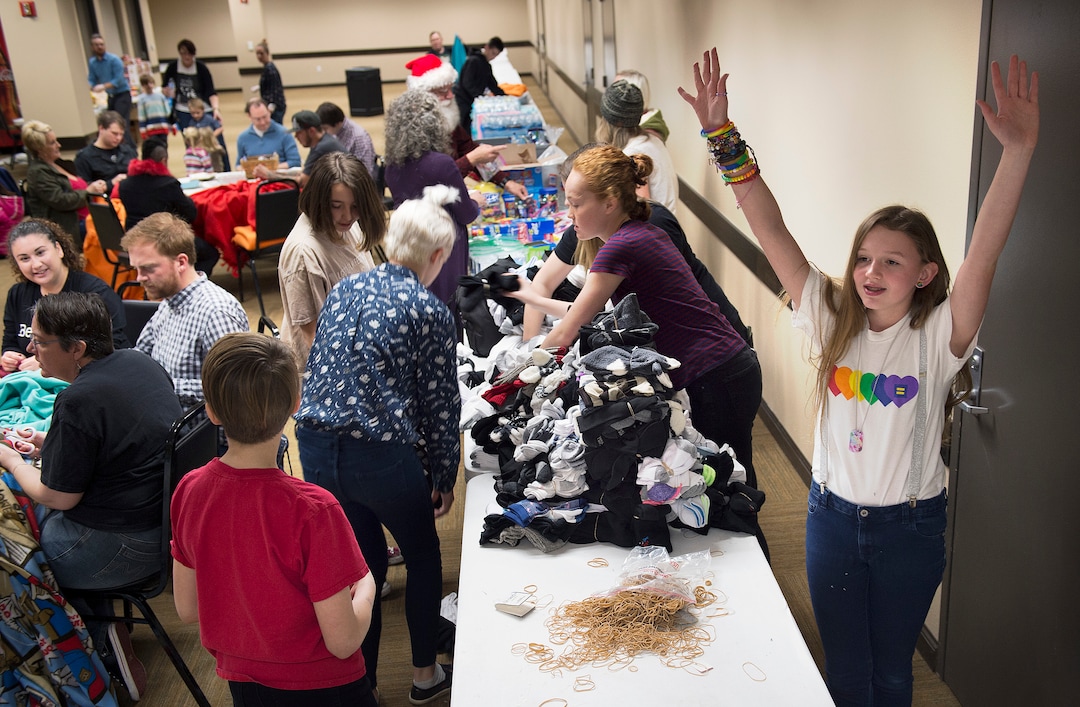 (Scott Sommerdorf   |  The Salt Lake Tribune)   
Savvanah raises her arms after she and other volunteers had finished sorting socks to be included in care packages for LGBT+ youth experiencing homelessness in the area, Thursday, December 14, 2017, as Lady Gaga's Born This Way Foundation hosted an event at the Maverick Center to assemble the gifts.
 Savannah has been collecting donated blankets, toiletries, backpacks and other essential items for the care packages, and Lady GagaÕs fans will be invited to support her efforts by donating such items at her Salt Lake City concert that evening.