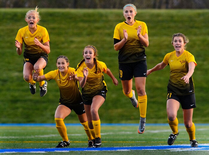 (Steve Griffin | The Salt Lake Tribune) Maple Mountain players leap in celebration as they defeat East in a shootout during 5A semifinal girl's soccer match at Juan Diego High School in Draper Tuesday October 17, 2017.