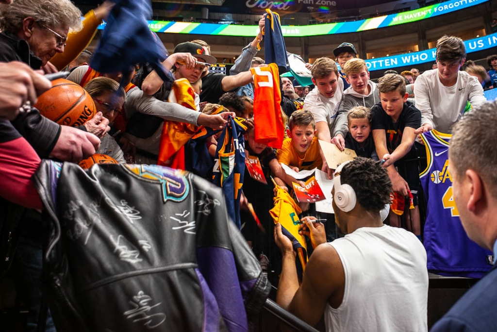 (Trent Nelson | The Salt Lake Tribune)  Fans swarm around Utah Jazz guard Donovan Mitchell (45) as the Utah Jazz prepare to host the Oklahoma City Thunder, NBA basketball in Salt Lake City on Monday March 11, 2019.