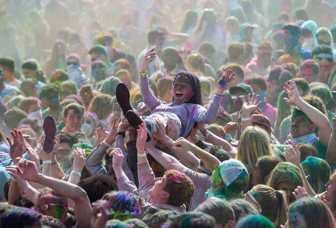 (Rick Egan  |  The Salt Lake Tribune)    Revelers help a friend crowd surf at the Holi Festival of Colors celebration at the Sri Sri Radha Krishna Temple in Spanish Fork, Saturday, March 30, 2019.