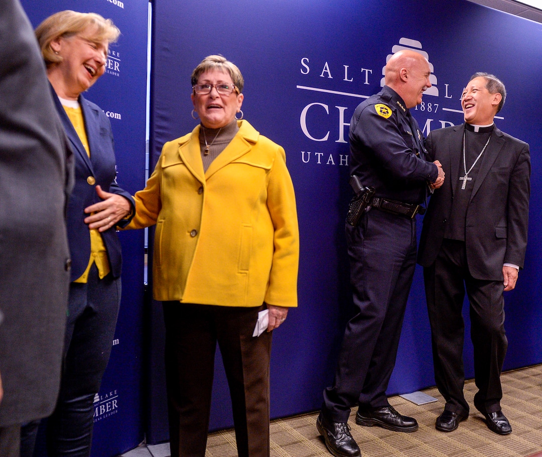 Leah Hogsten  |  The Salt Lake Tribune  l-r Mike Brown, Chief of the Salt Lake City Police Department shares a laugh with Bishop Oscar A. Solis, leader of Utah's Catholic community after the two signed The Utah Compact, Thursday reaffirming the principles initially adopted in 2010. The compact emphasizes humane treatment of immigrants, keeping families together and focusing deportation on serious criminals.