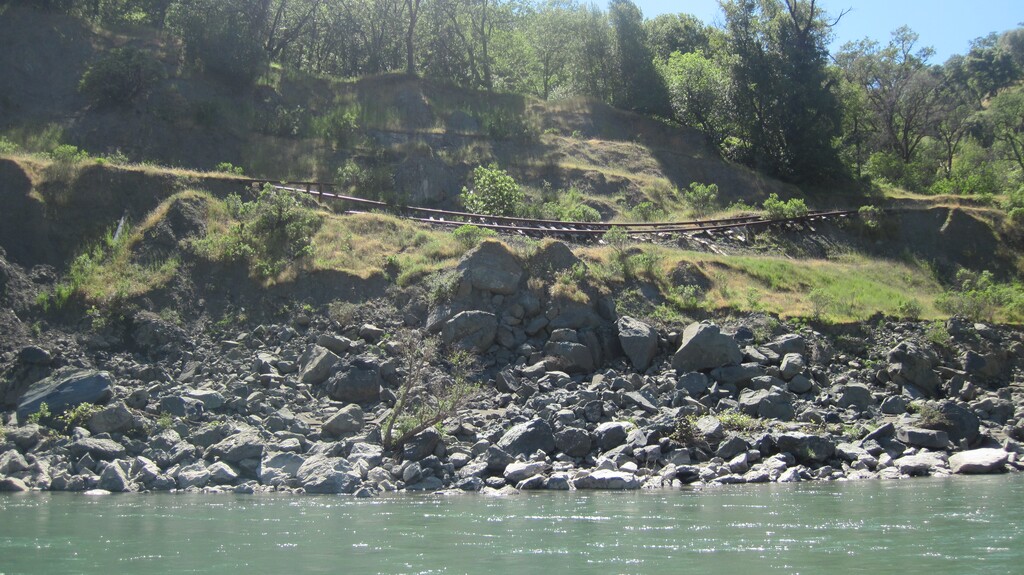 (Friends of the Eel River) The North Coast Railroad was built a century ago along northern California’s scenic Eel River but hasn't been usable since at least 1998. Now a shadowy company with suspected ties to the Western coal industry is seeking to acquire the line in a bid to move unspecified freight to a port at Humboldt Bay.