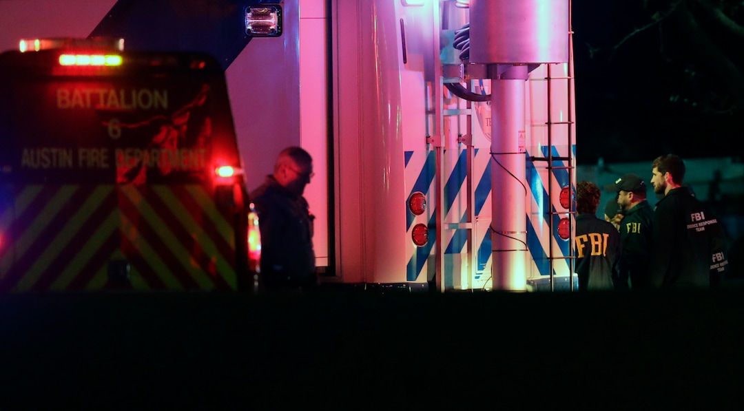 Officials work at the scene early Wednesday, March 21, 2018, in the Austin suburb of Round Rock, Texas, where according to authorities the suspect in a spate of bombing attacks that have terrorized Austin over the past month blew himself up with an explosive device as authorities closed in. (AP Photo/Eric Gay)