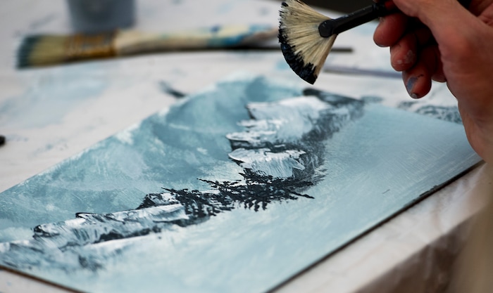 (Leah Hogsten  |  The Salt Lake Tribune) Students paint "happy" trees and "fantastic" mountains during the  Bob Ross Paint-Along class, Saturday, January 6, 2018 at the Salt Lake City Public Library's Sweet Branch in the Avenues. 