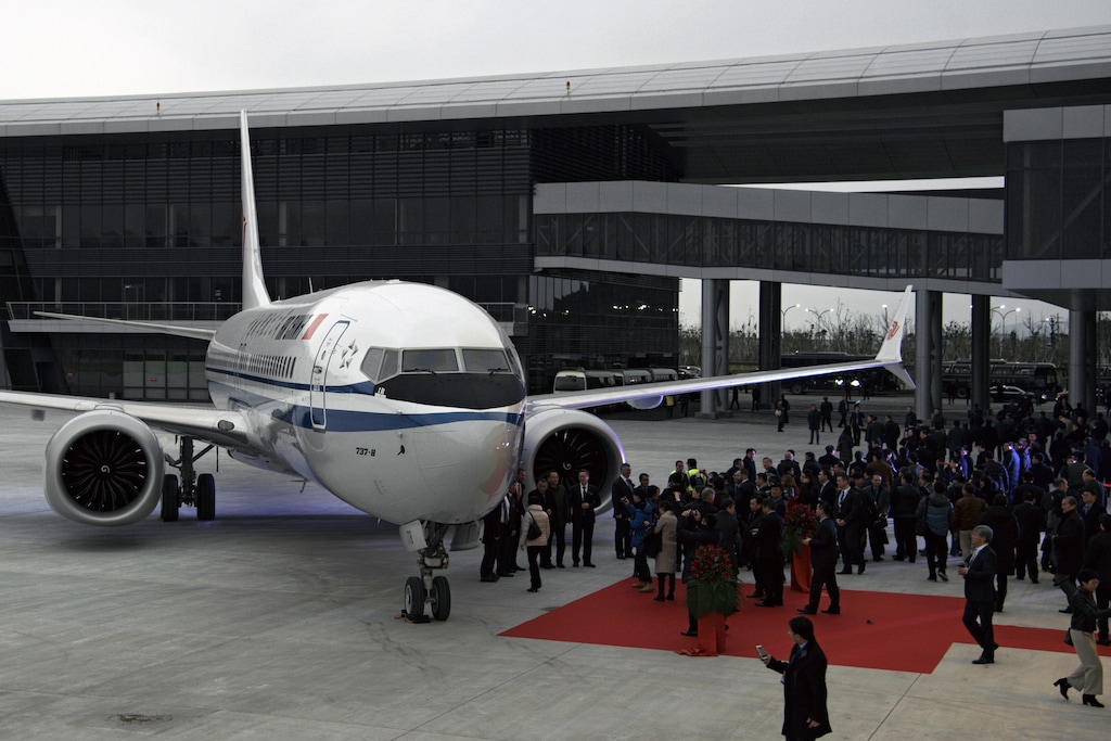 (Chinatopix via AP)  In this Dec. 15, 2018, photo, invited guests look at the Boeing 737 Max 8 airplane parked on tarmac after being delivered to Air China at Boeing Zhoushan 737 Completion and Delivery Center in Zhoushan, east China's Zhejiang Province. China's civilian aviation authority has ordered all Chinese airlines to ground their Boeing 737 Max 8 planes on Monday, March 11, 2019 after one of the aircraft crashed in Ethiopia. The authority said the one-day action was made out of safety concerns because the crash was similar to one in Indonesia last year.