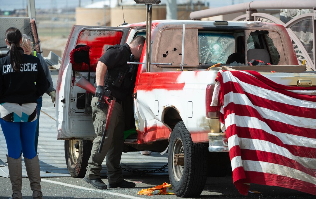 (Francisco Kjolseth  | The Salt Lake Tribune) Investigators remove a double barrel shotgun from a vehicle as numerous police agencies respond to a man driving erratically and claiming to have a gun and a bomb with an initial police chase ending on Center Street over Legacy Highway on Wednesday, March 17, 2021. The suspect was taken into custody.