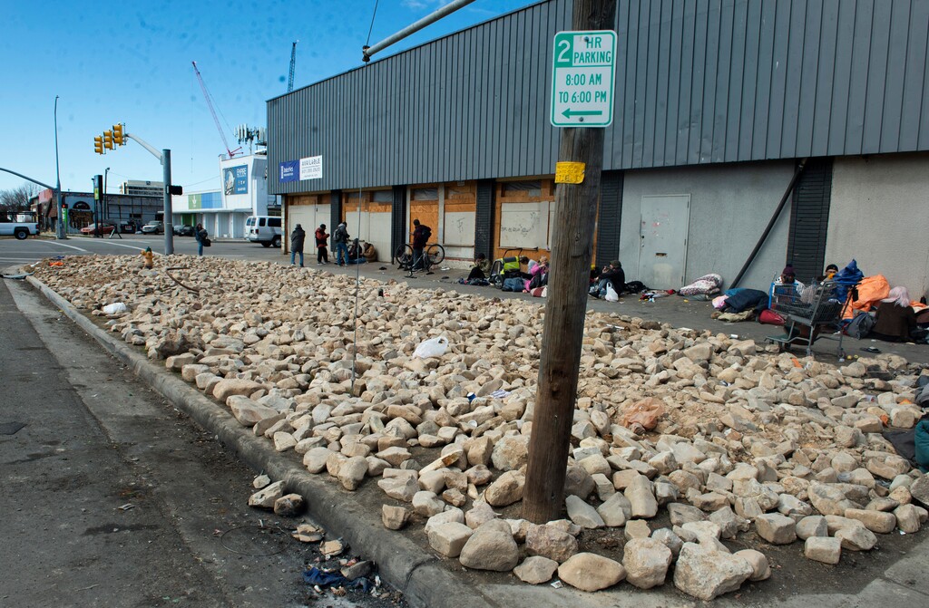(Rick Egan | The Salt Lake Tribune) The grass park strip, where unsheltered people used to pitch their tents, has been replaced by giant rocks on the corner of 700 South and State Street, on Tuesday, Feb. 23, 2021.