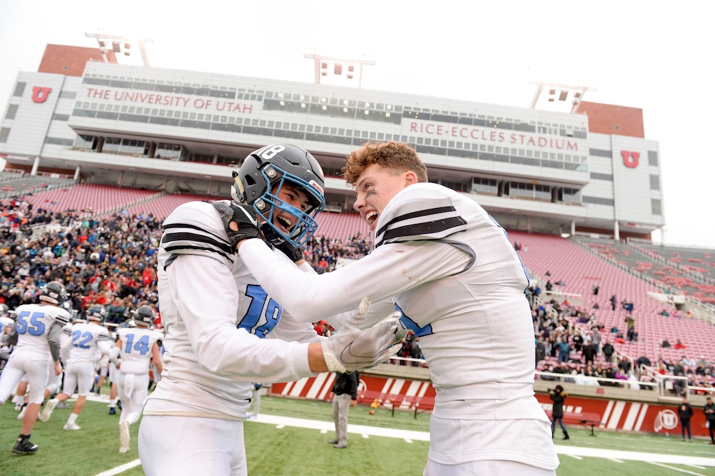 (Leah Hogsten | The Salt Lake Tribune) Sky View's Mason Falslev (right) celebrates with teammate Tate Ballard after the Bobcats 35-0 win over Park City for the Class 4A state football championship last Friday at Rice-Eccles Stadium. Falslev is a Utah basketball signee.