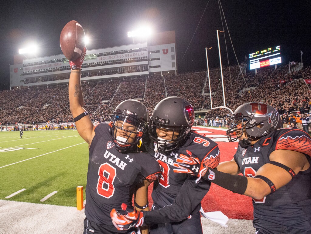 (Rick Egan | Tribune file photo) Utah Utes wide receiver Kaelin Clay (8) celebrates with wide receiver Tim Patrick (9) after scoring the game winning touchdown, with 8 seconds left in the game, giving the Utes a 24-12 victory of the USC Trojans in Pac-12 action, at Rice-Eccles Stadium, Saturday, October 25, 2014.