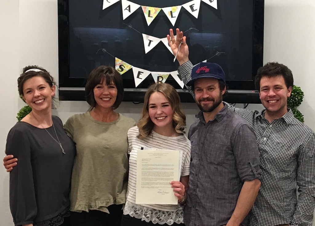 (Courtesy | Katrina Hughes.) Katrina Hughes poses with her children after her youngest child, Lydia Hughes, opened her mission call letter in February 2017. Lydia's older brothers, Jordan and Spencer, pranked her with a fake mission call.