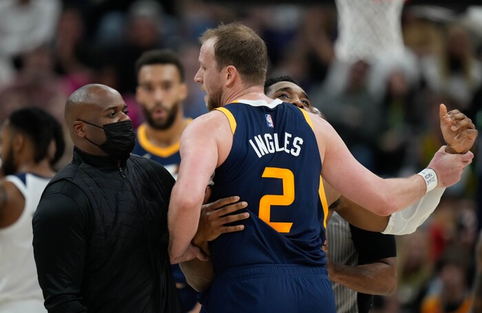 (Francisco Kjolseth | The Salt Lake Tribune) Utah Jazz guard Joe Ingles (2) is held back by Utah Jazz guard Donovan Mitchell (45) during an altercation in the first half in NBA action between the Utah Jazz and the Minnesota Timberwolves at Vivint Smart Home Arena in Salt Lake City, Thursday, Dec. 23, 2021.