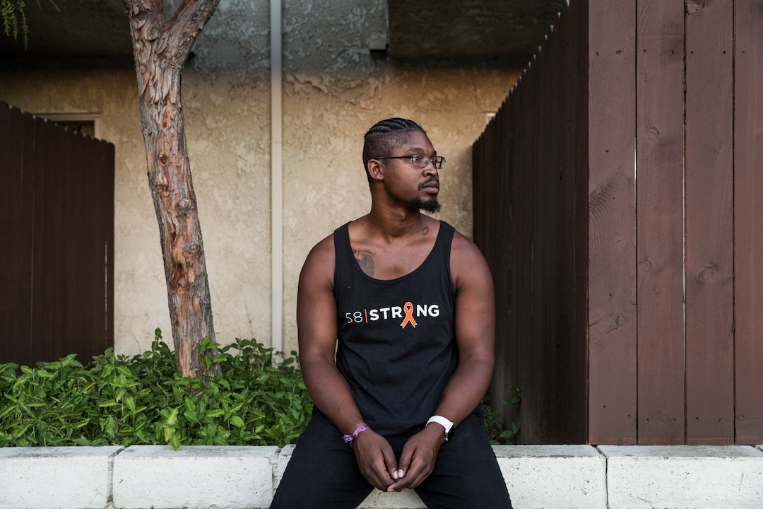 (Emily Berl | The Washington Post) Jonathan Smith outside his apartment building in Buena Park, Calif. Smith survived the 2017 Las Vegas massacre and the bullet hole on his left shoulder is still visible. He returned to the shooting site a year later, part of a long road to recovery.