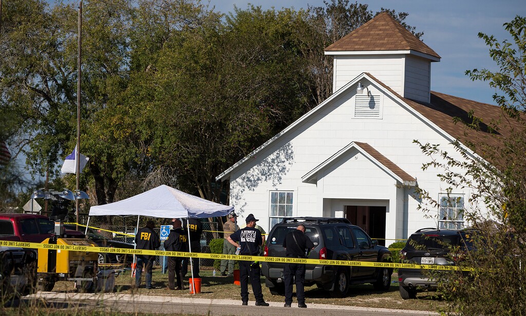 (Nick Wagner/Austin American-Statesman via AP) Law enforcement officials works at the scene of a fatal shooting at the First Baptist Church in Sutherland Springs, Texas, on Sunday, Nov. 5, 2017.