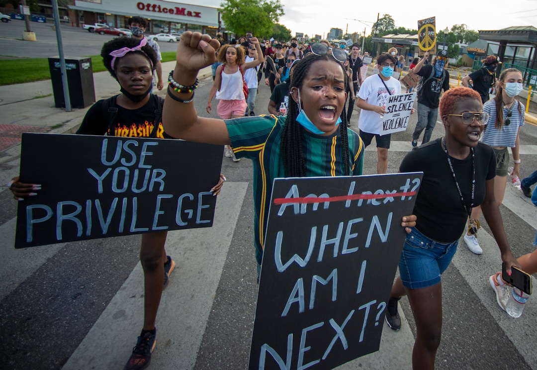 (Rick Egan  |  The Salt Lake Tribune)     Nadine Bahati leads the group of protesters in a chant as they head up 400 South to the University off Utah during a George Floyd demonstration, Wednesday, June 3, 2020.