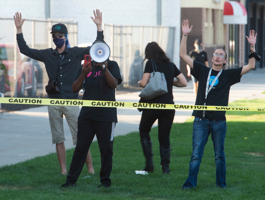 (Rick Egan  |  The Salt Lake Tribune)  People protest at the site of a police shooting near an apartment complex on Fayette Avenue near Main Street and 965 South in Salt Lake City, where the police shot and killed a man they attempted to arrest for a parole violation, on Thursday, Aug. 27, 2020.