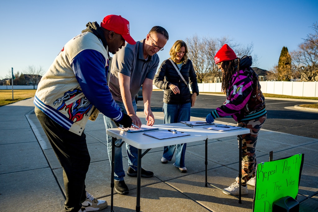 (Trent Nelson  |  The Salt Lake Tribune) Steve Johnson Jr and Uneaka Best gather signatures to repeal Prop 4 at Linda Vista Park in Syracuse, Utah on Thursday, Feb. 5, 2026.
