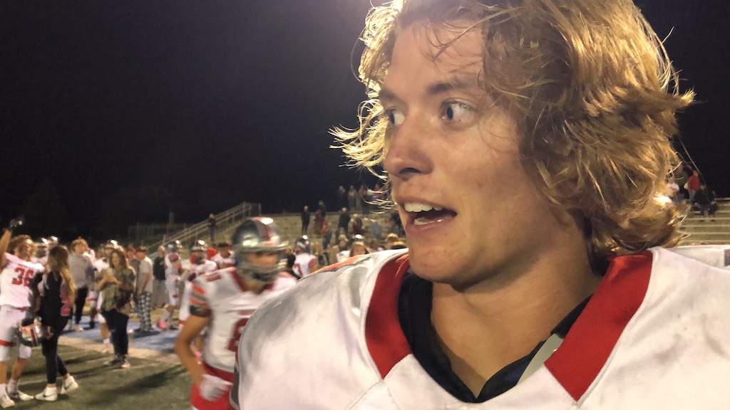 (Sammy Mora | The Tribune) Mountain Ridge quarterback Ayden Helm's touchdown run gave the Sentinels an overtime victory against West Jordan on Friday night.