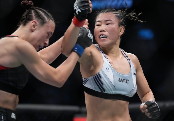 (Francisco Kjolseth | The Salt Lake Tribune) UFC bantamweight fighter Wu Yanan of China, right, faces Lucie Pudilova of Czechia UFC 278 during their mixed martial arts bout in the octagon in Salt Lake City on Saturday, Aug. 20, 2022. 