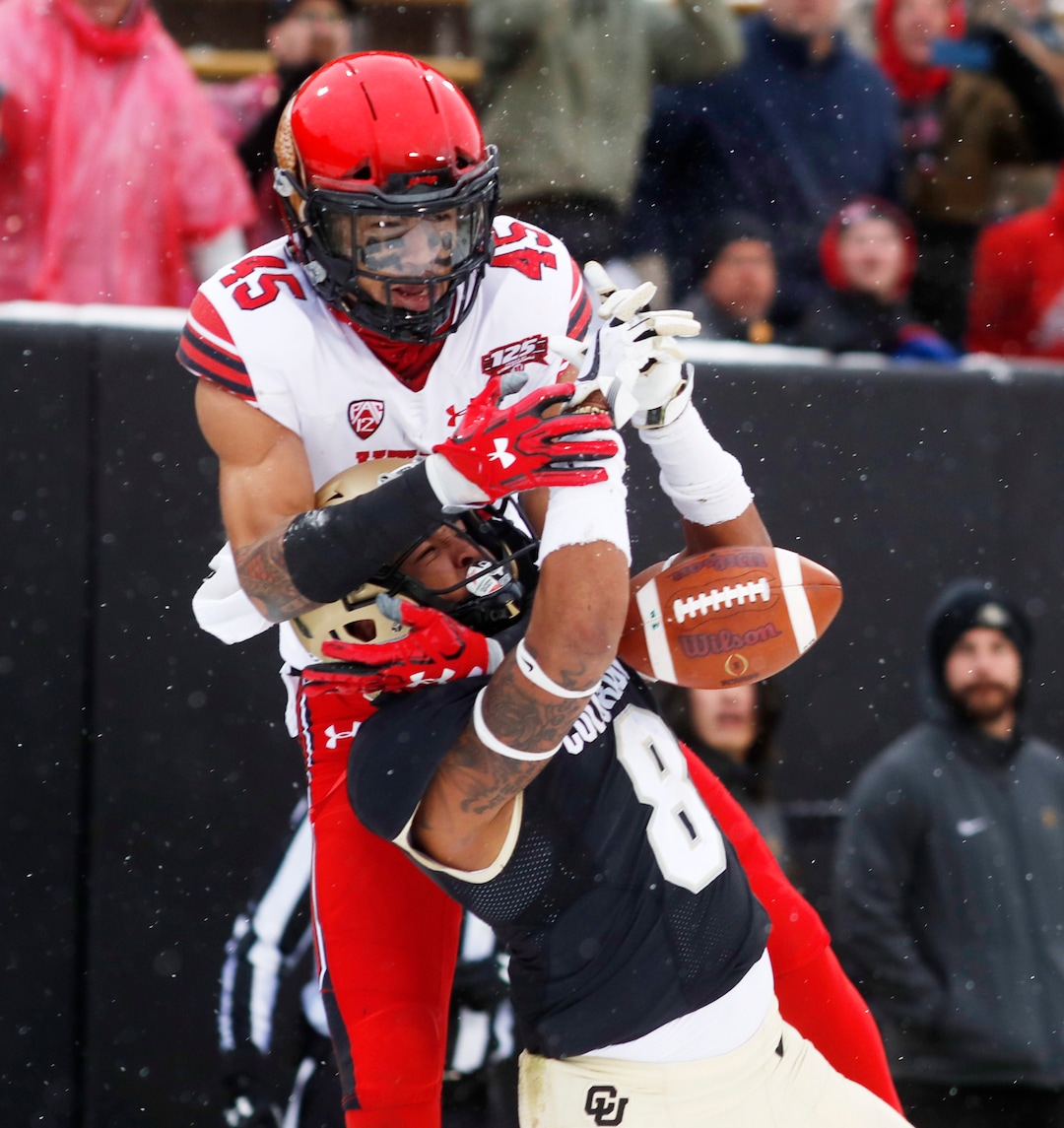 Colorado defensive back Trey Udoffia, front, breaks up a pass intended for Utah wide receiver Samson Nacua in the second half of an NCAA college football game Saturday, Nov. 17, 2018, in Boulder, Colo. Utah won 30-7. (AP Photo/David Zalubowski)