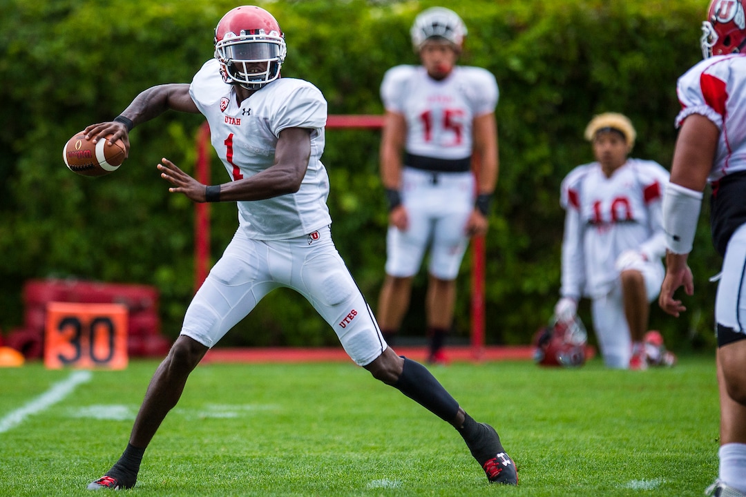 (Chris Detrick  |  The Salt Lake Tribune) Utah Utes quarterback Tyler Huntley (1) throws the ball during practice Tuesday, August 22, 2017. 