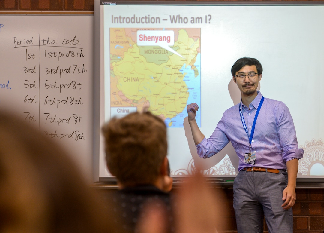 (Leah Hogsten  |  The Salt Lake Tribune) Oquirrh Hills Middle School eighth grade math instuctor Pinyi Yao introduces himself and where he is from in China to his classroom on the first day of school. Pinyi Yao, 27, a Chinese National teaching 7th and 8th grade math welcomes his students on their first day of the school year at Oquirrh Hills Middle School, August 20, 2019 in Riverton.