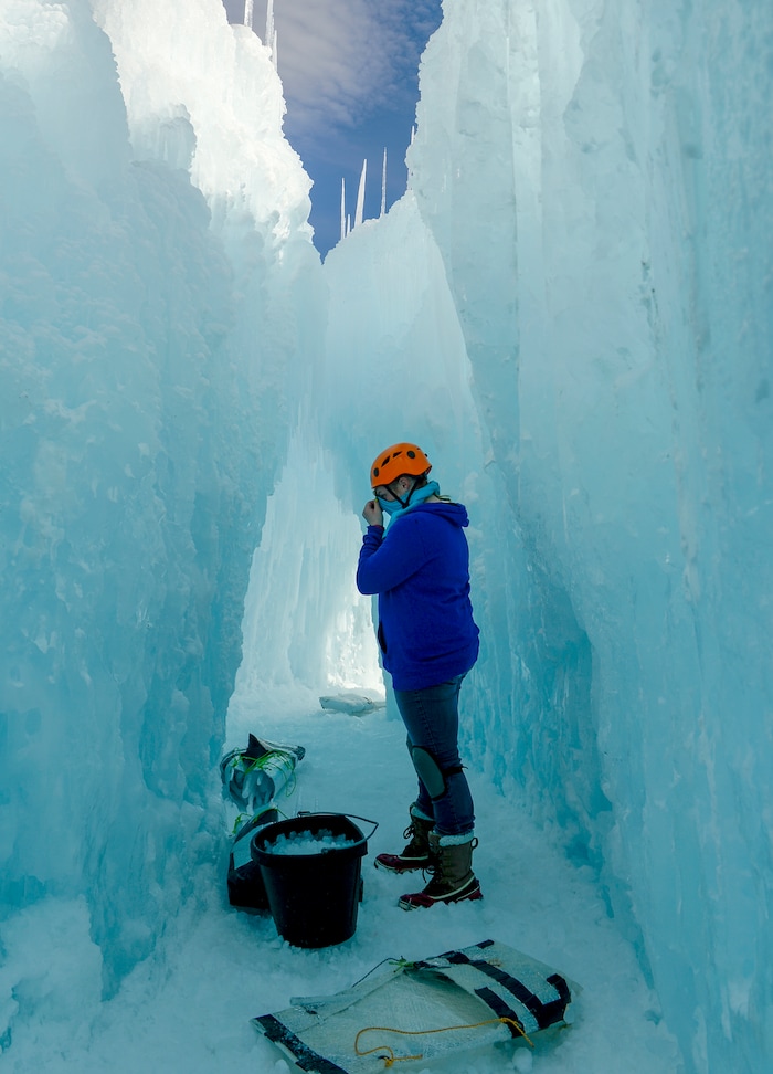 Leah Hogsten | The Salt Lake Tribune Sara Juvenal works on the installation, Friday, Jan. 4, 2019. The idea started with a backyard castle in Alpine followed by an ice castle in downtown Midway in 2009. Ice Castles is open for the winter Saturday, Jan. 5, at Homestead Resort. This is the ninth season the popular frozen art installation is drawing visitors to walk around the giant LED-lit icicle formations.