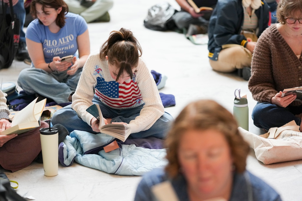 (Bethany Baker | The Salt Lake Tribune) People read together in the Capitol Rotunda as part of a read-in to protest Utah book bans, hosted by Let Utah Read, in Salt Lake City on Friday, Feb. 13, 2026.