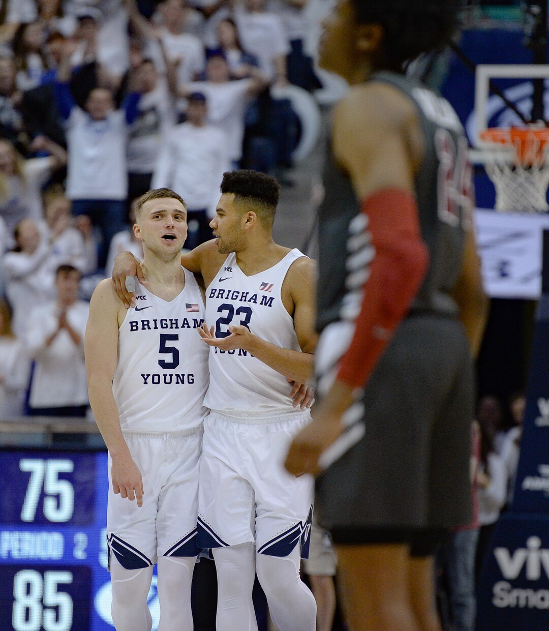 (Francisco Kjolseth  |  The Salt Lake Tribune) Brigham Young Cougars guard Jake Toolson (5) and Brigham Young Cougars forward Yoeli Childs (23) come together following their 85-75 win over the Santa Clara Broncos at the Marriott Center in Provo, Thursday, Feb. 20, 2020. 