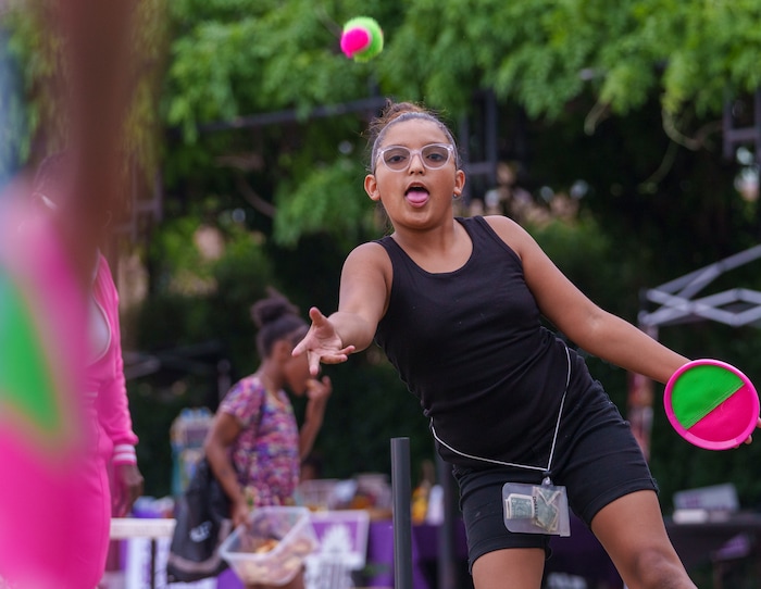(Leah Hogsten | The Salt Lake Tribune) Kailani Holston, 10, plays with her cousin at the Utah Juneteenth Celebration at the Ogden City Amphitheater, Saturday, June 18, 2022. 