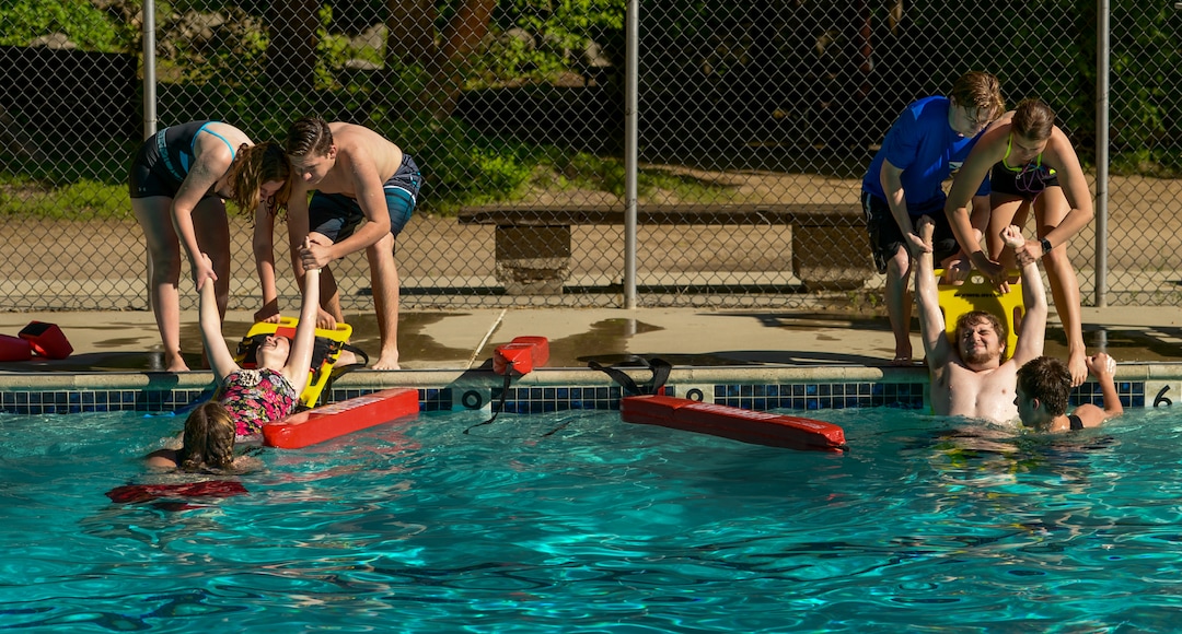 (Leah Hogsten  |  The Salt Lake Tribune) Students in BSA's Camp Tracy beginning lifeguard class learn how to pull victims from the water, Thursday, May 24, 2018. The three girls and four boys in the class will assume lifeguarding duties at Scout camps throughout Utah this summer.