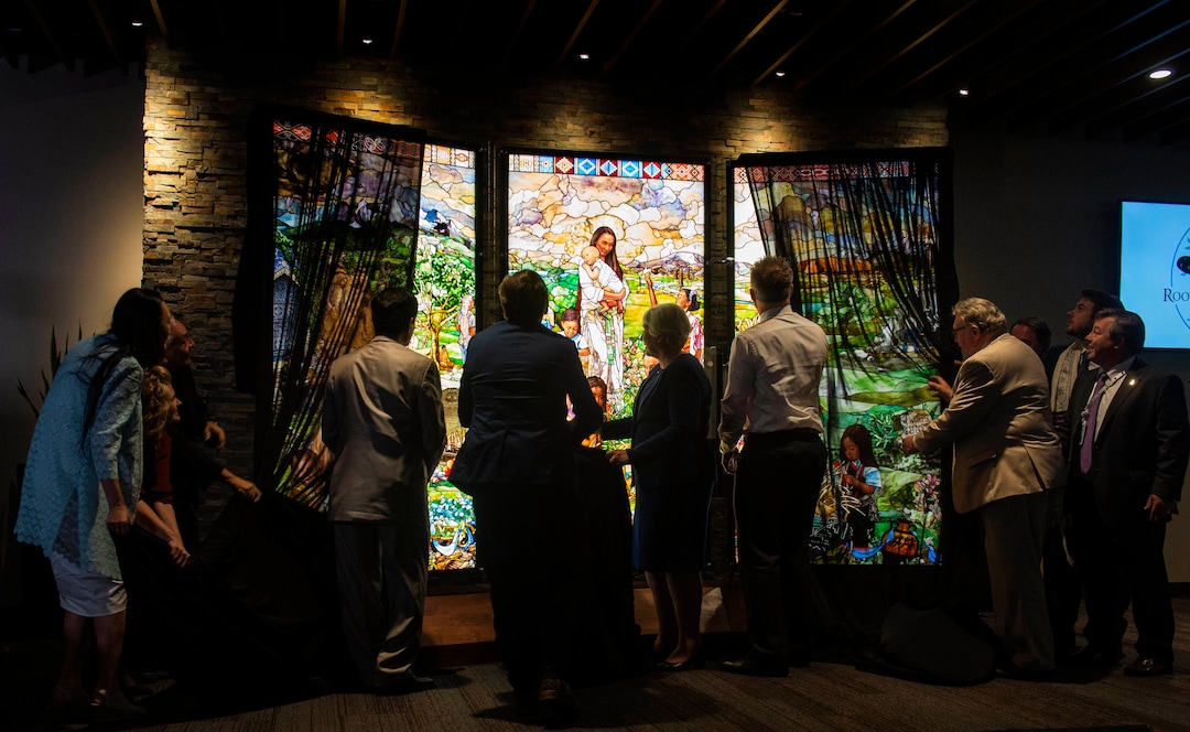 (Rick Egan  |  The Salt Lake Tribune)     Dignitaries unveil the first three of its "7 Pillars" windows, created by artist Tom Holdman, during a Roots of Humanity Foundation ceremony, at the 100 Club room at the Vivint Smart Home Arena, Sunday, Aug. 25, 2019.