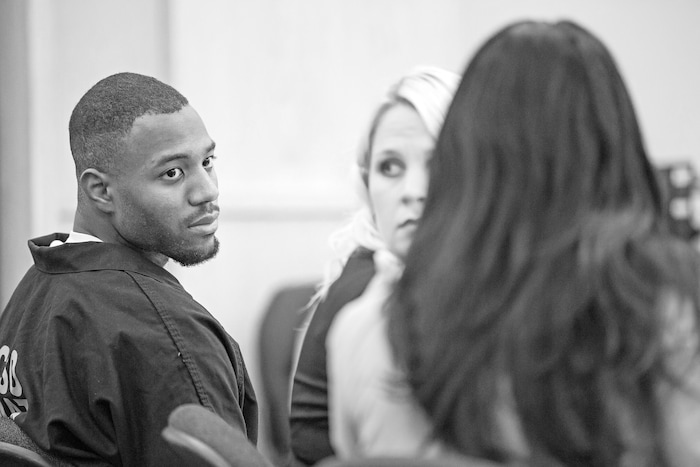Former Utah State University linebacker Torrey Green leans toward his defense attorney, Skye Lazaro, in the 1st District Court on Thursday € the second day of a three-day preliminary hearing. Green is charged with six counts of rape, one count of aggravated kidnapping, three counts of forcible sex abuse and two counts of object rape. (Tim Carpenter/Utah Statesman)