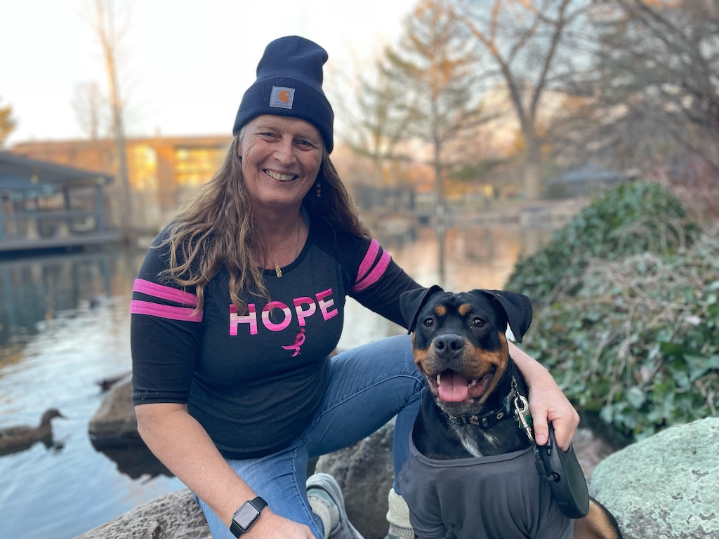 (Matthew LaPlante  |  Utah State University) Ally Cleveland, player on the women's pro football team Utah Falconz and a coach for 10- and 11-year-old players, with her dog, LiaRhea.