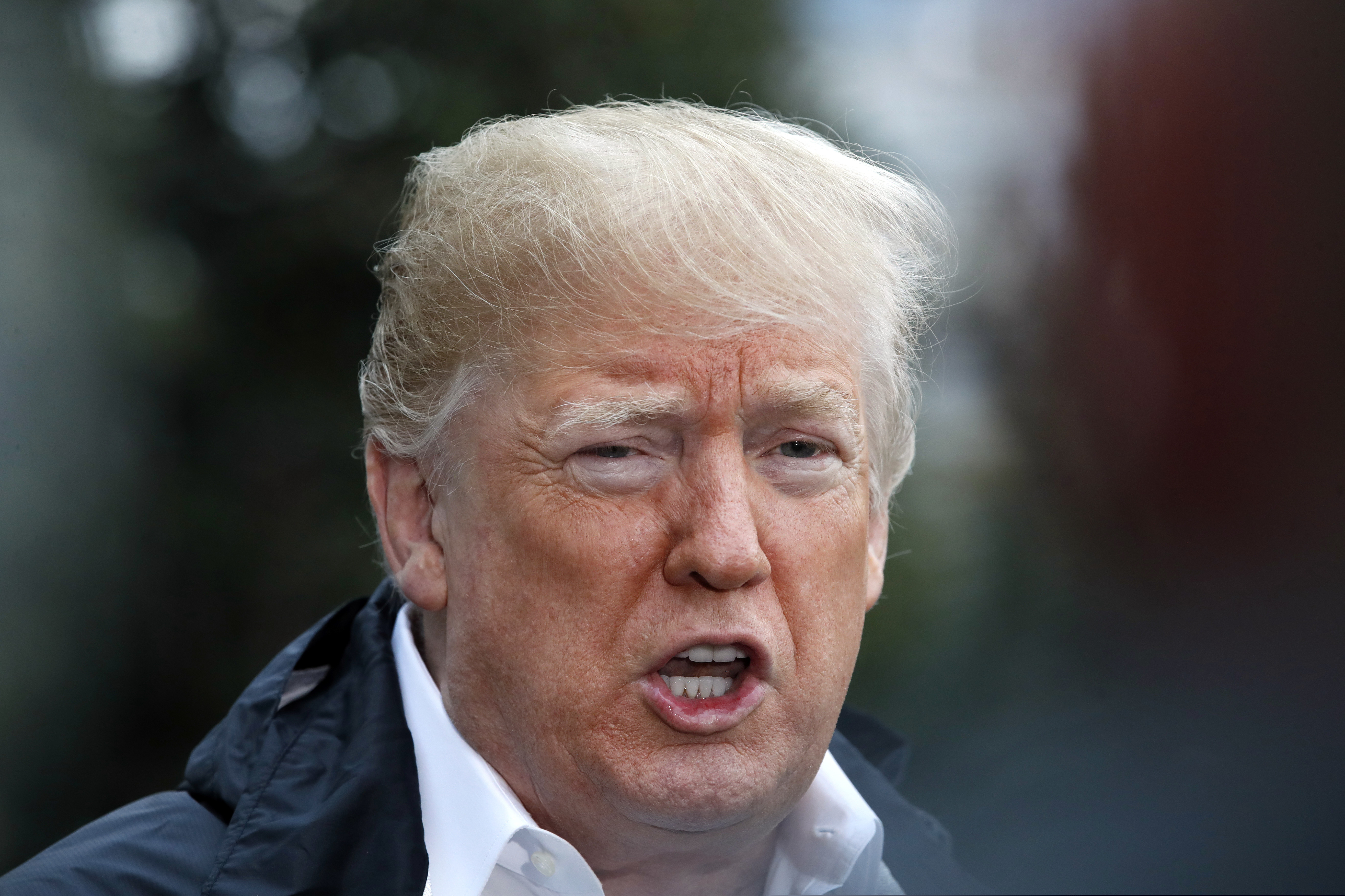President Donald Trump answers a question from a member of the media as he leaves the White House, Saturday Nov. 17, 2018, in Washington, en route to see fire damage in California. (AP Photo/Jacquelyn Martin)