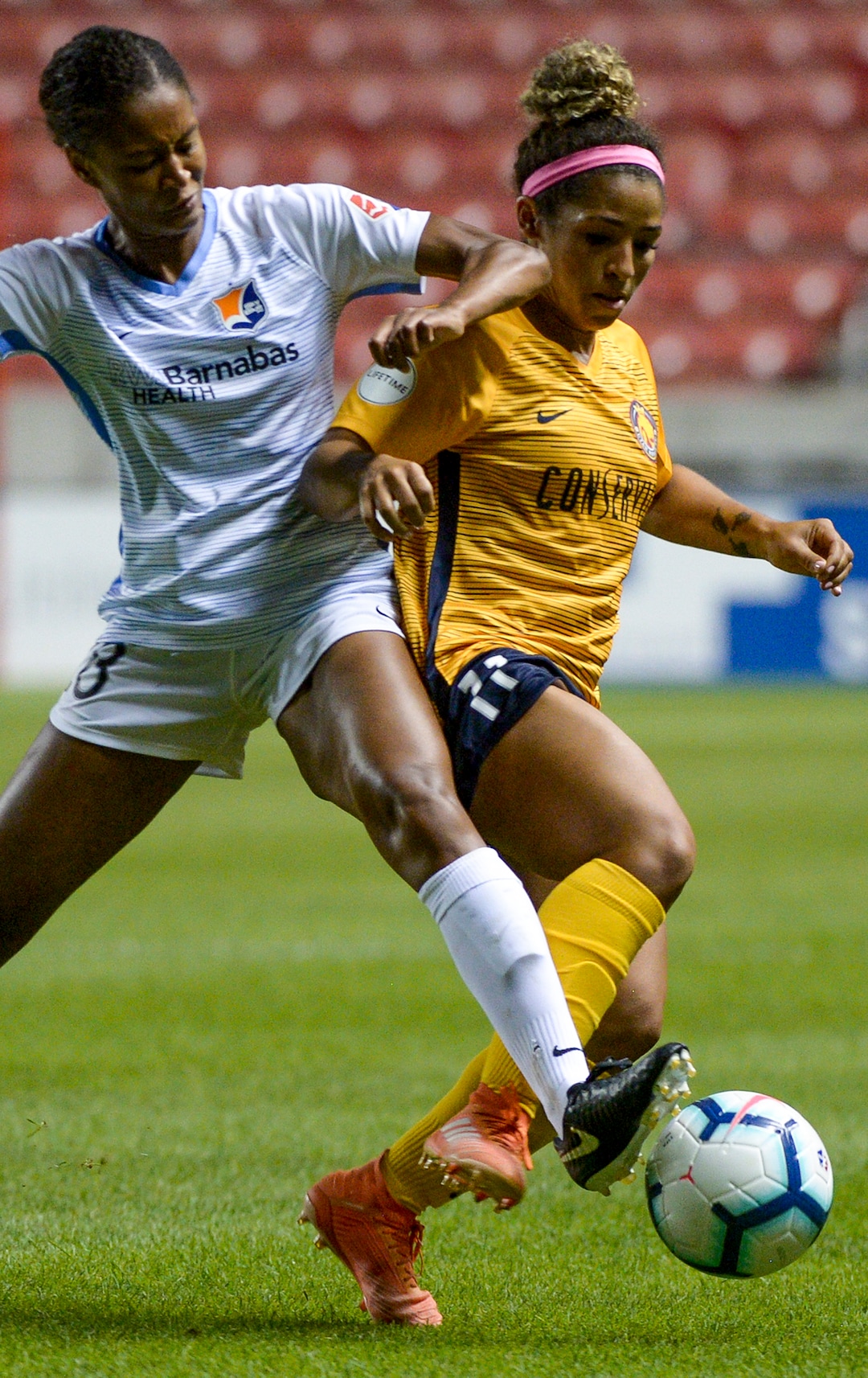 (Leah Hogsten  |  The Salt Lake Tribune) Utah Royals FC midfielder Desiree Scott (11) and Sky Blue FC defender Sabrina Flores (18) battle for the ball as the Utah Royals FC host Sky Blue FC, August 7, 2019 at Rio Tinto Stadium.