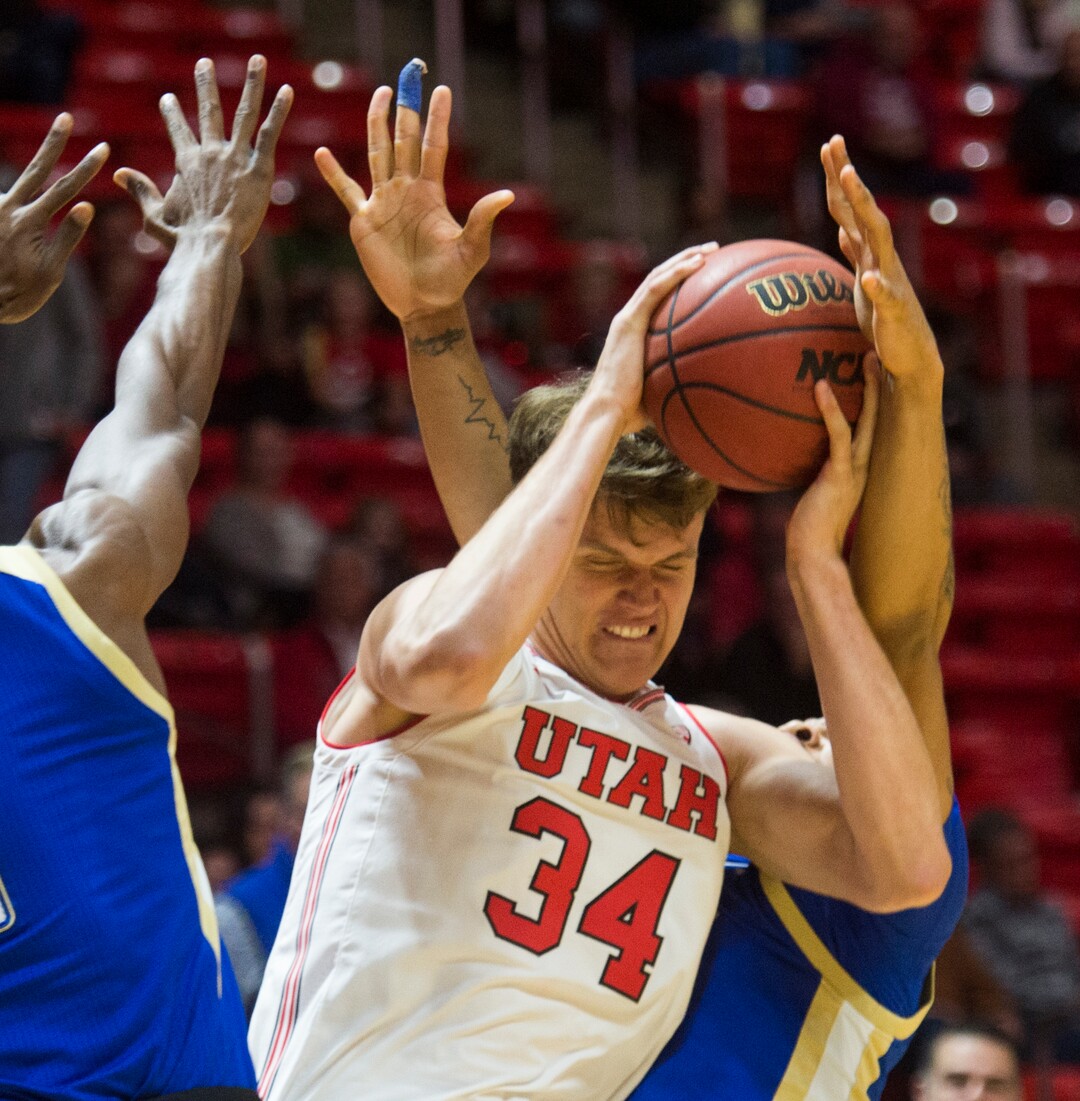 (Rick Egan  |  The Salt Lake Tribune)    Utah Utes center Jayce Johnson (34) tries to get a shot as Tulsa forward Martins Igbanu (1) and Tulsa guard DaQuan Jeffries (2) defend for the Golden Hurricane's,  in basketball action between, Utah Utes and Tulsa Golden Hurricane, at the Jon M. Huntsman Center, Saturday, Dec. 1, 2018.