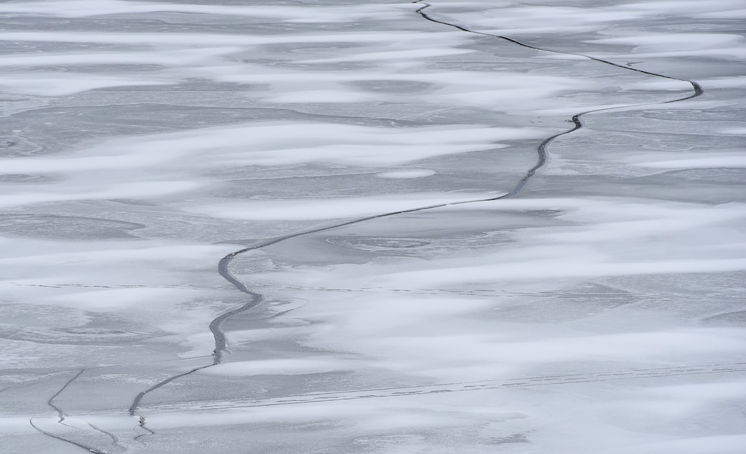 (Francisco Kjolseth  |  The Salt Lake Tribune)  Cracks form on the ice at Echo Reservoir in Summit County next to Coalville which could soon become a state park.
