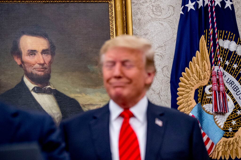 A painting of President Abraham Lincoln is seen behind President Donald Trump as he attends a ceremonial swearing in ceremony for new Labor Secretary Eugene Scalia in the Oval Office of the White House in Washington, Monday, Sept. 30, 2019. (AP Photo/Andrew Harnik)